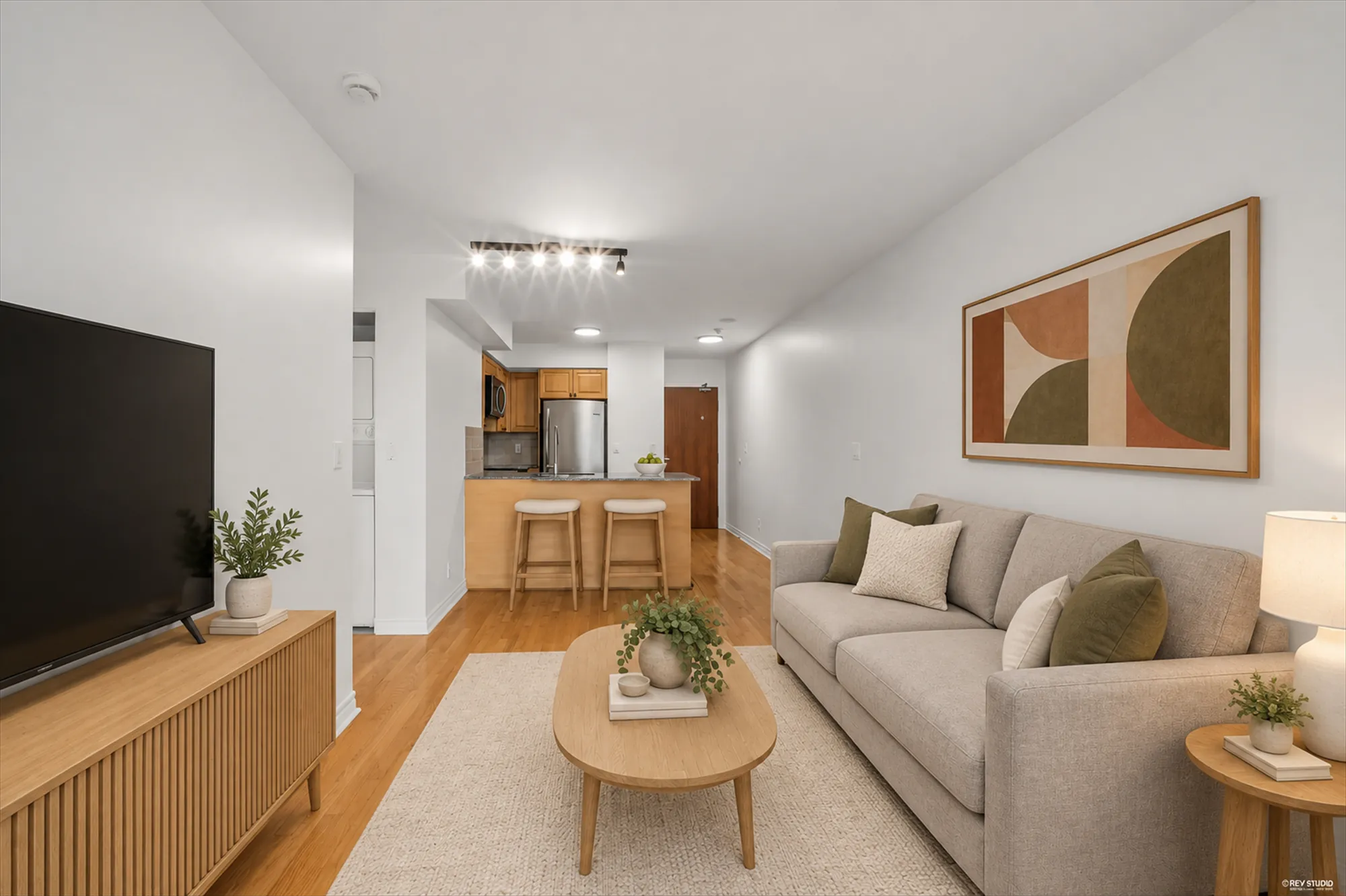 The same view virtually staged: sofa, coffee table, television, stools and a picture added